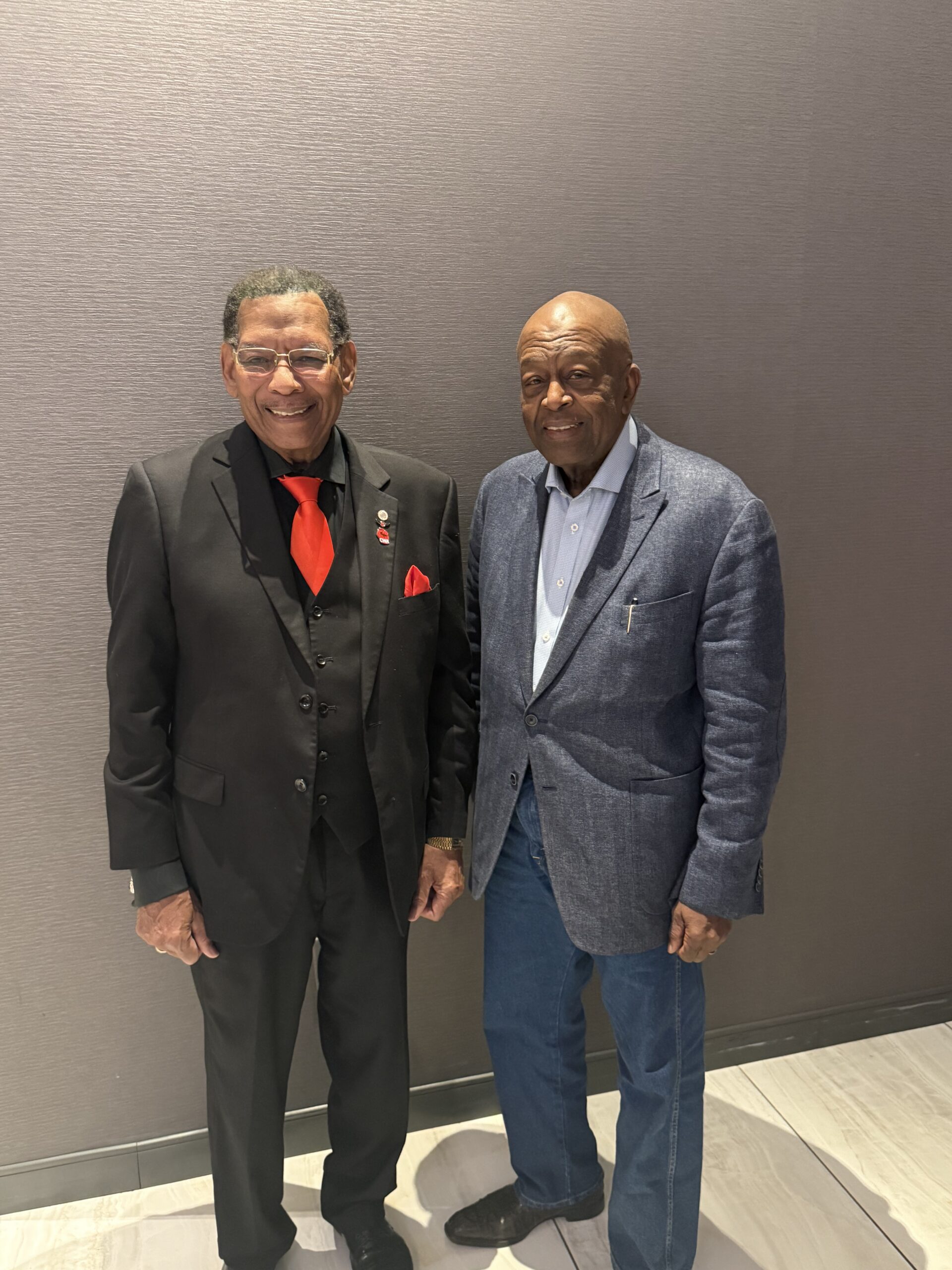 Dr. Ronald A. Bartlett, Founder of Ronald A. Bartlett & Associates, LTD, pictured with Claude Cummings Jr., President of the CWA, at the District 4 Convention in 2026.